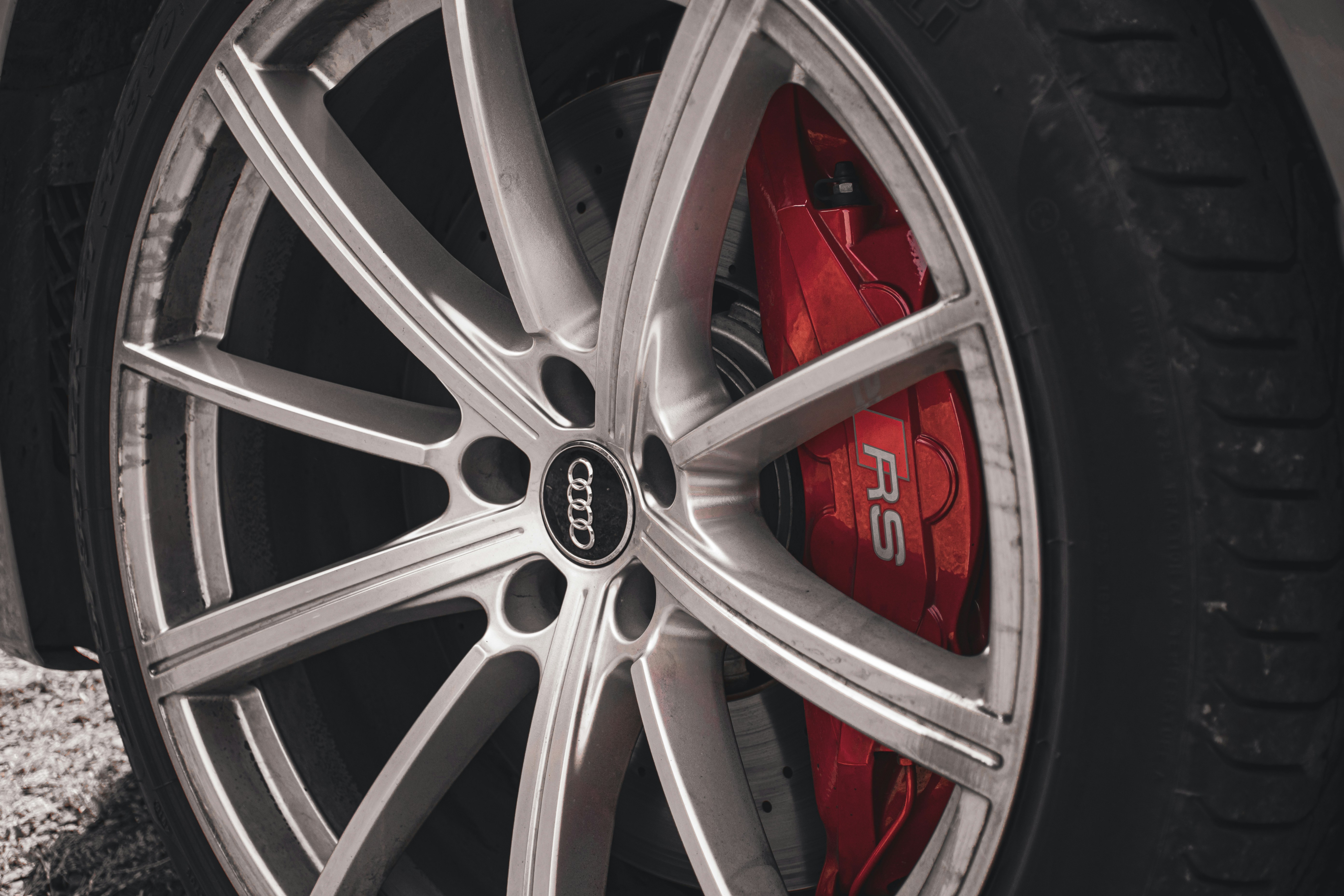 Audi RS red brake caliper through alloy wheel spokes